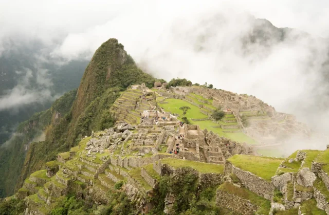 high-angle-beautiful-machu-picchu-citadel-surrounded-by-foggy-mountains-urubamba-peru